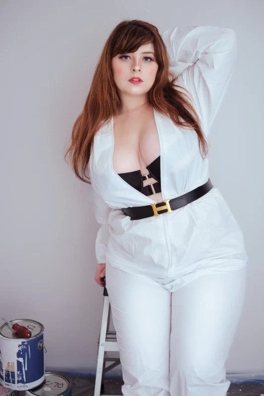 painter bea york posing in white jumpsuit with hermes belt